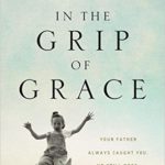 Cover of the book, "In the Grip of Grace." A man tossing his daughter into the air while playing is featured on the cover.