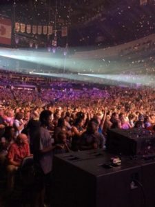 A crowd of people in an arena.